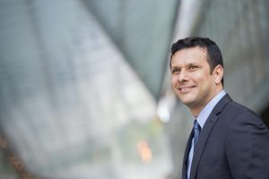 A latino businessman in business clothes.